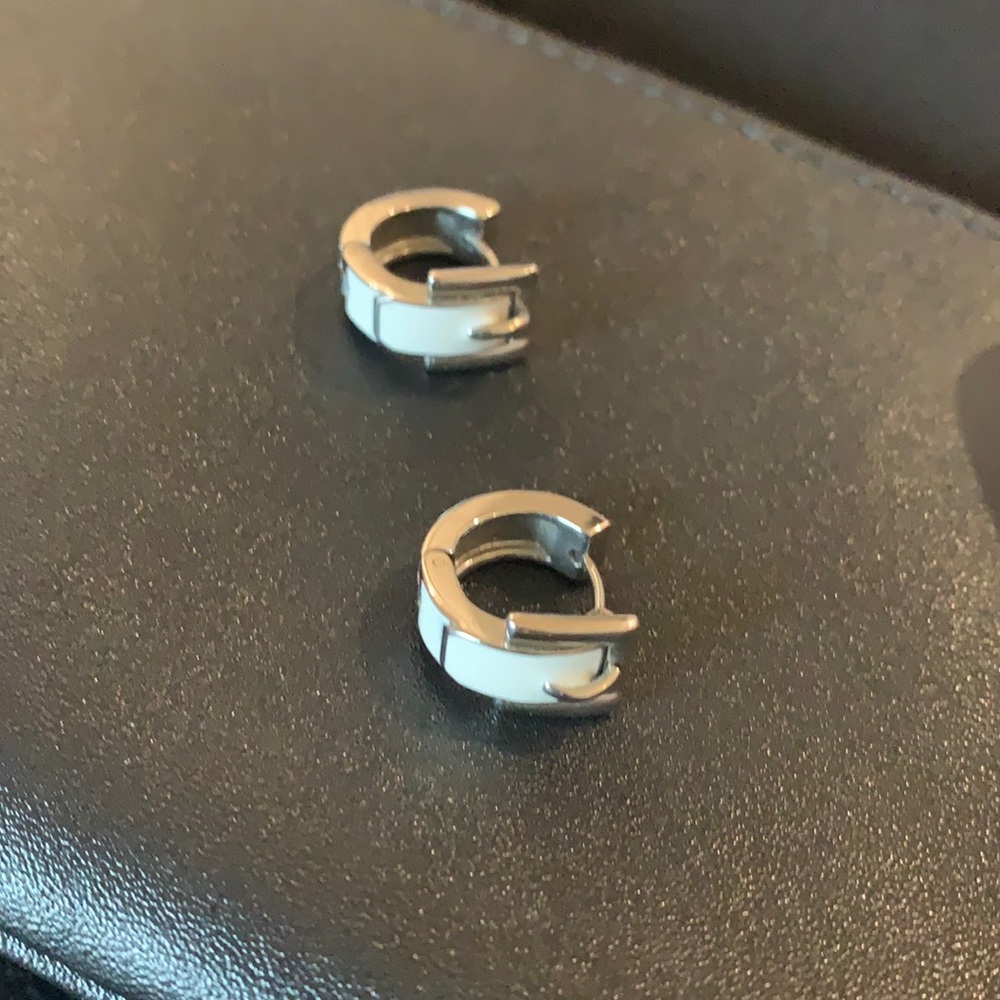 Michael Kors silver with white earrings.